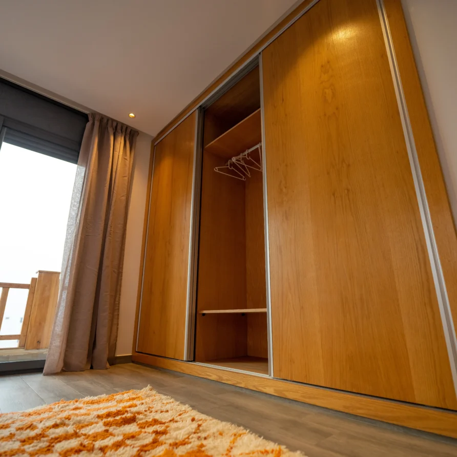 Wooden wardrobe in Magic Room at Imsouane surf hostel