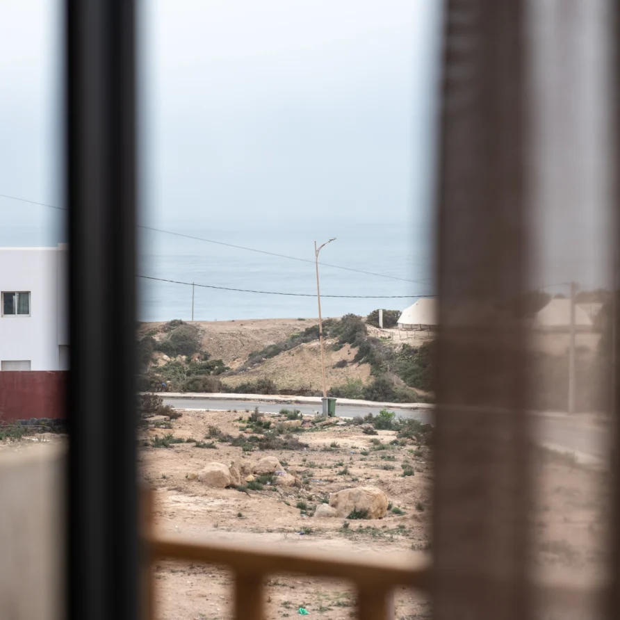 View from room window toward hills and the Atlantic coastline at Residence Imsouane