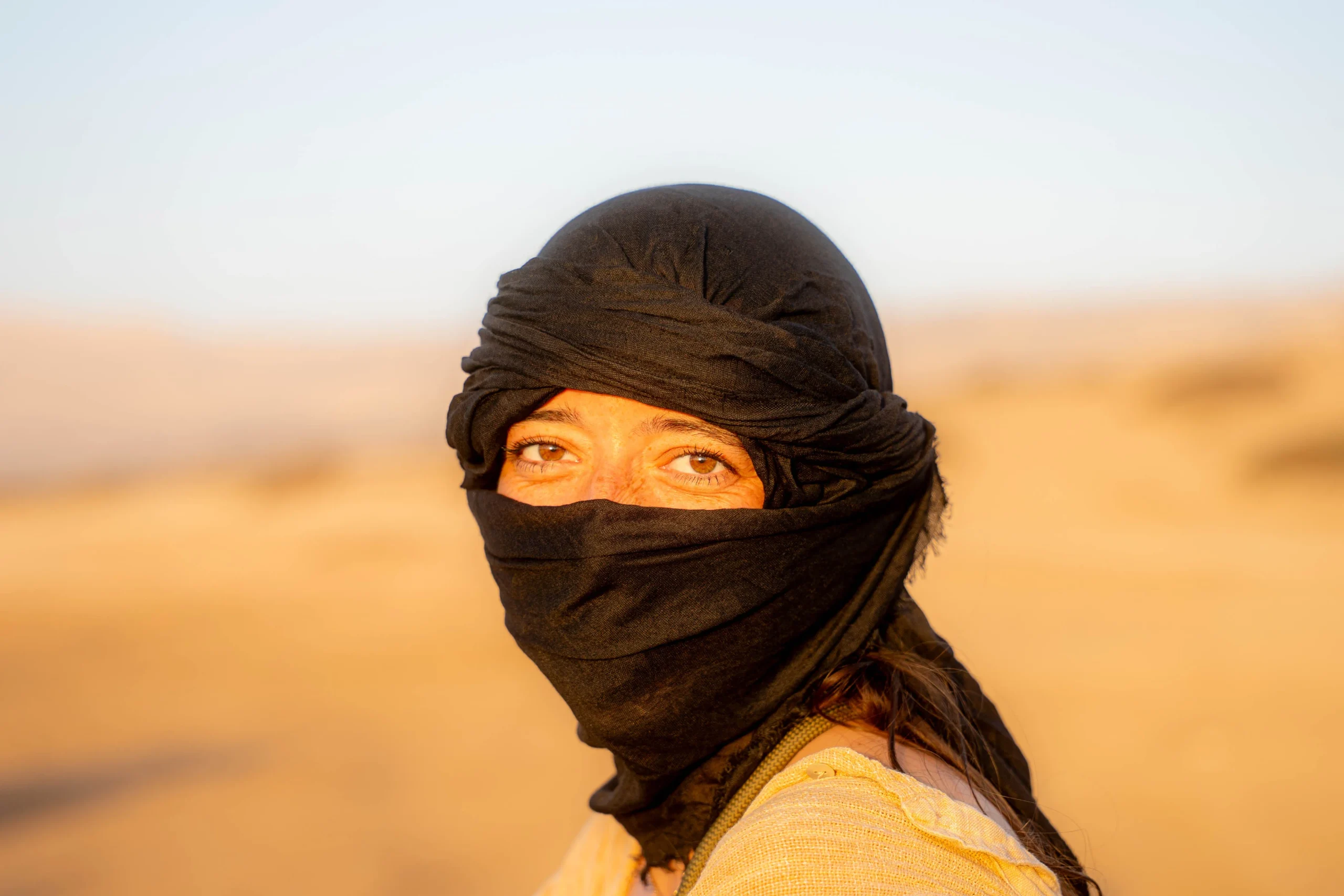 surfer girl in timlaline wearing moroccan traditional reza
